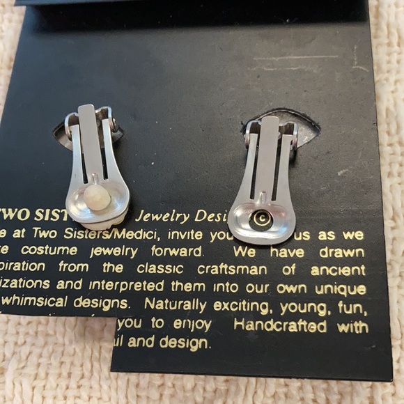 5/$25 Two sisters Lauren and Leah handcrafted pewter and blue clip earrings. - Picture 2 of 3